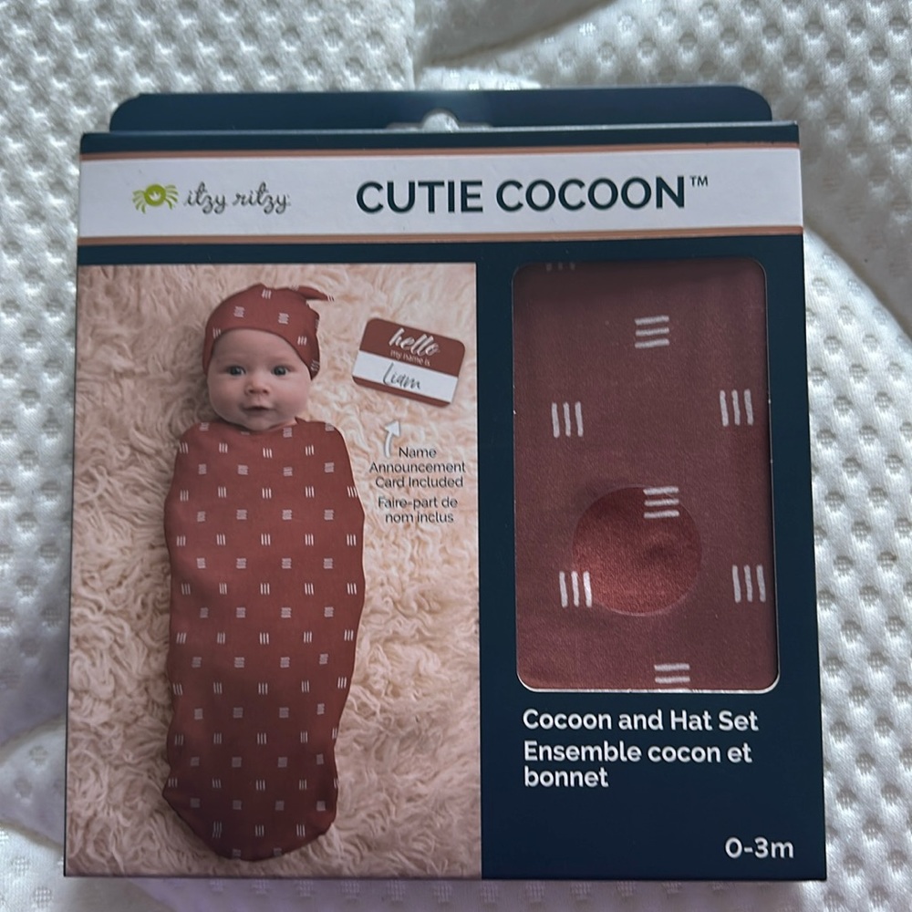 It’s ritzy cutie cocoon with hat and announcement card. NIB